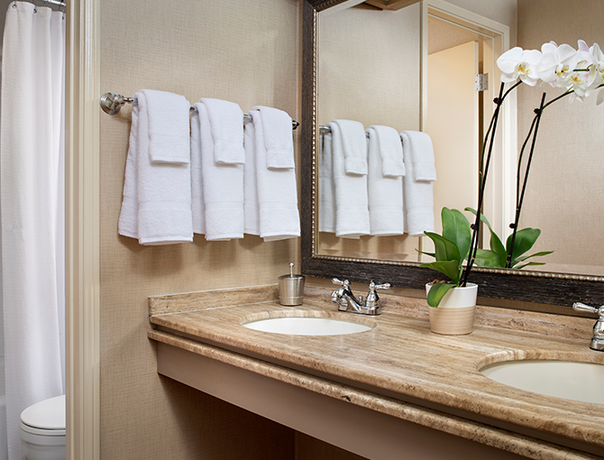 Double sinks with towel rack