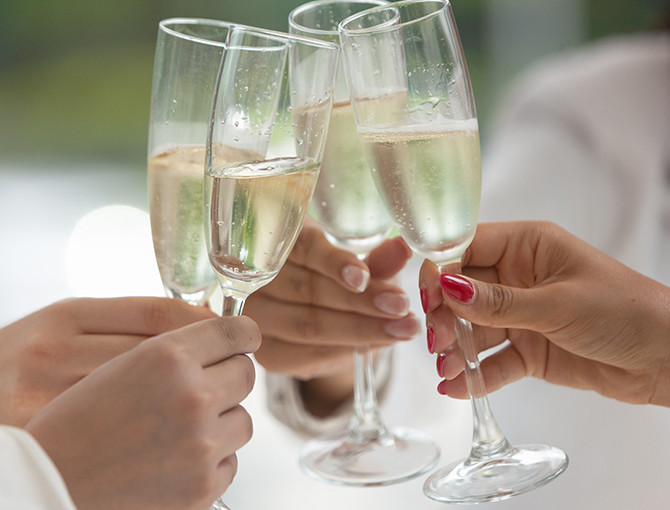 Wedding toast in the lush gardens at the Bahia Resort Hotel