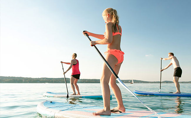 Stand up paddling by the shores of Mission Bay after a day of remoting working and distance learning at the Bahia Resort Hotel