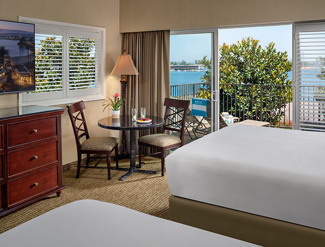 Interior Bay view room with two queen beds looking out to Mission Bay