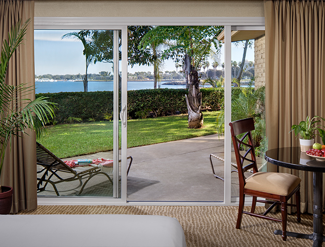 View of patio and Mission Bay from Resort View room at the Bahia Resort Hotel in Mission Beach, San Diego