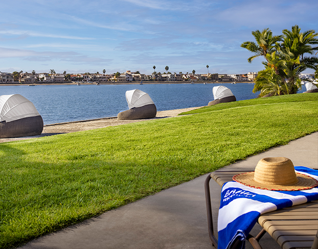 Deluxe Bayfront Suite with a view of cabanas and Mission Bay from the patio at the Bahia Resort Hotel in San Diego