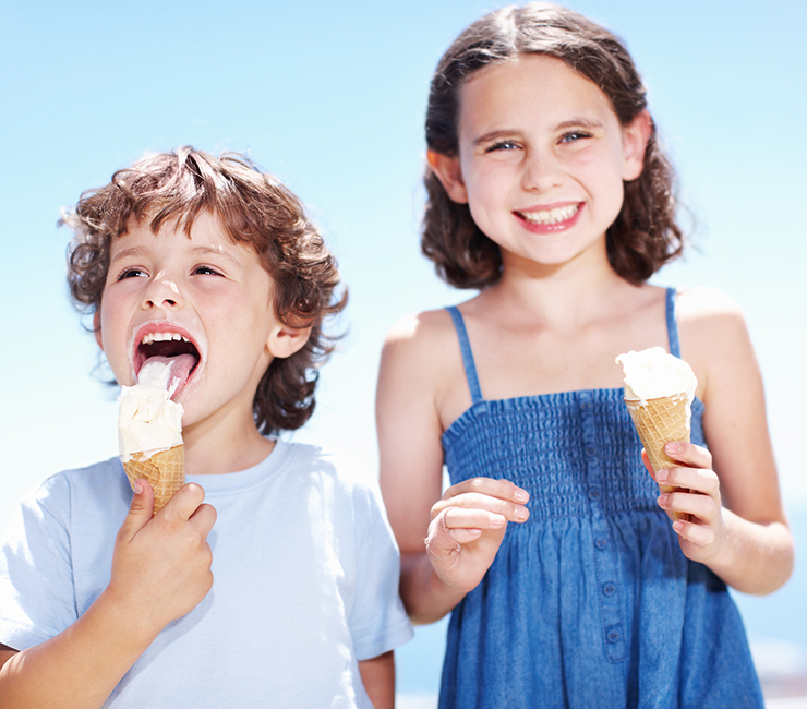 Two kids enjoying ice cream during the fall activities at the Bahia Resort Hotel on Mission Bay, San Diego.