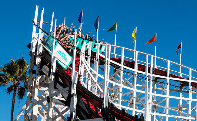 People riding the wooden coaster at Belmont Park, San Diego