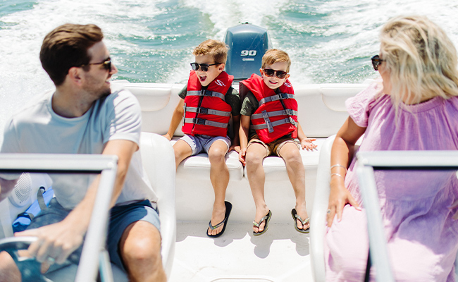 Family of four enjoying a boat ride on Mission Bay on day 1 of their 3-day fall itinerary in San Diego