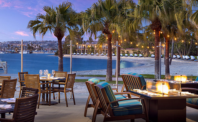 The outdoor dining area at Dockside 1953, one of the best San Diego restaurants with a view at the Bahia Resort Hotel in Mission Bay