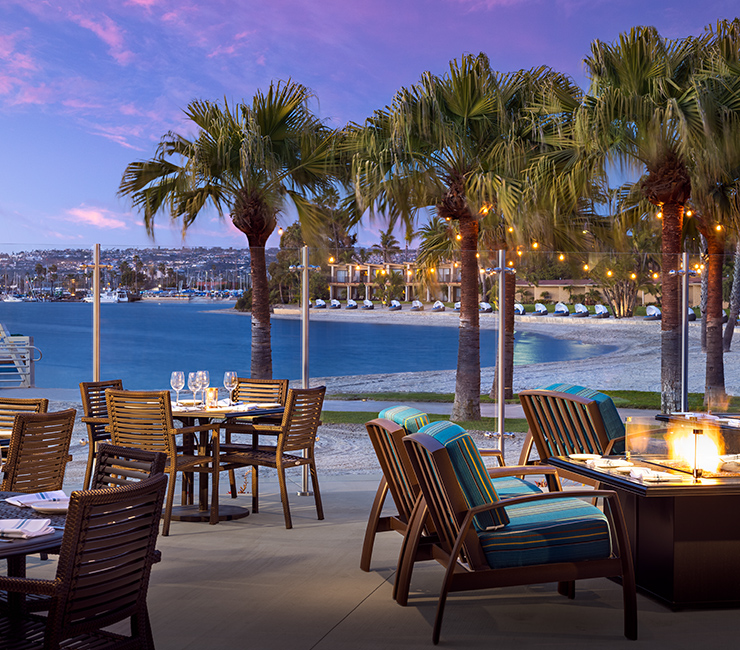 Outdoor dining by Mission Bay at Dockside 1953 at the Bahia Resort Hotel in San Diego, CA