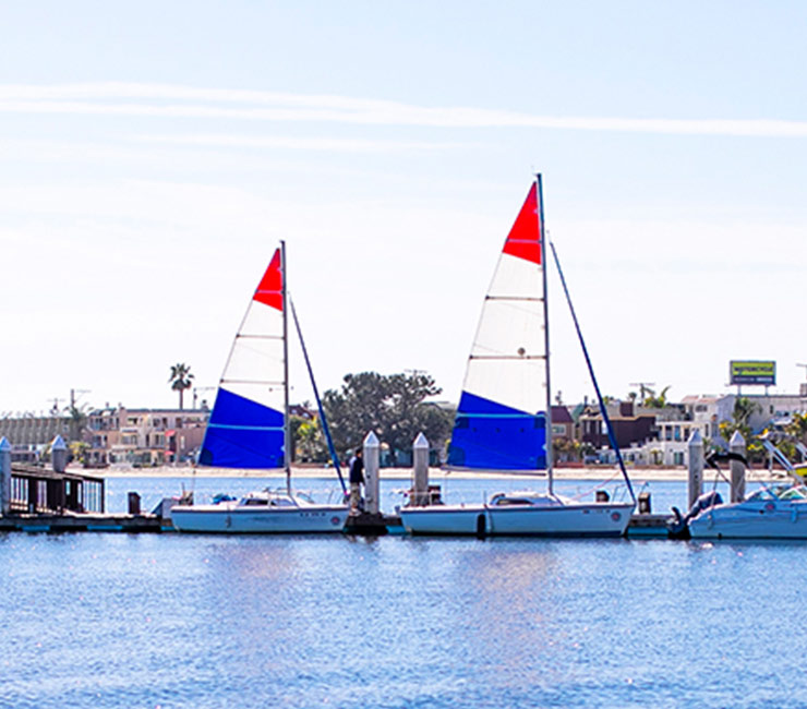 Sail boats at the dock in Mission Bay ready for team building events at the Bahia Resort Hotel in San Diego