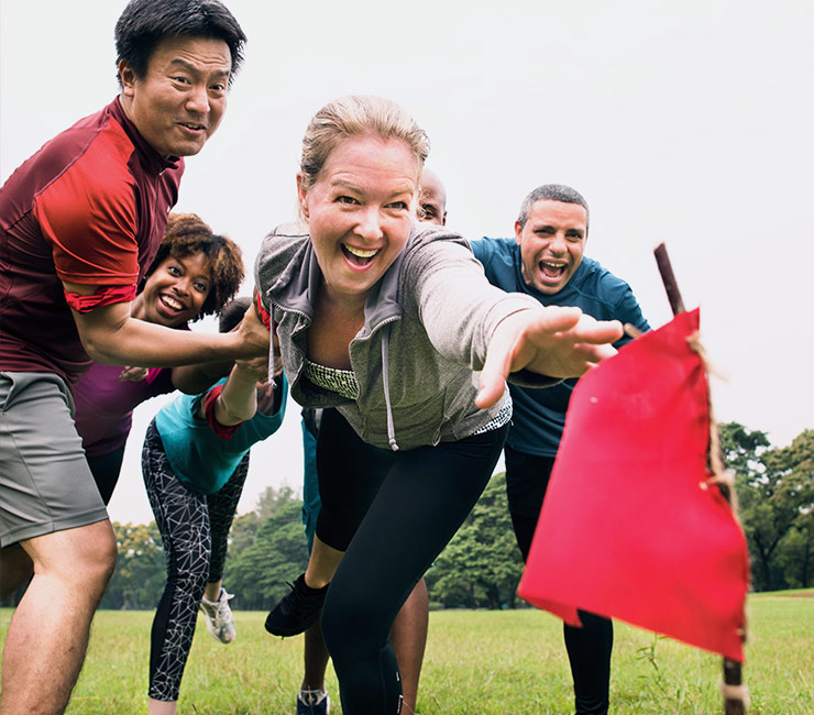 Colleagues race to capture the flag in their amazing race during team building events in San Diego at the Bahia Resort Hotel