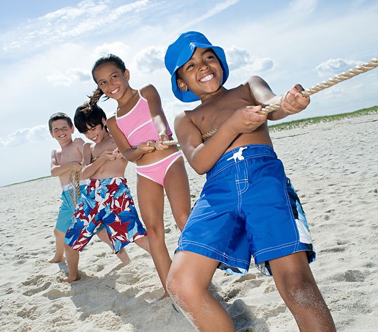 Family playing beach games at the Bahia Resort on Mission Bay