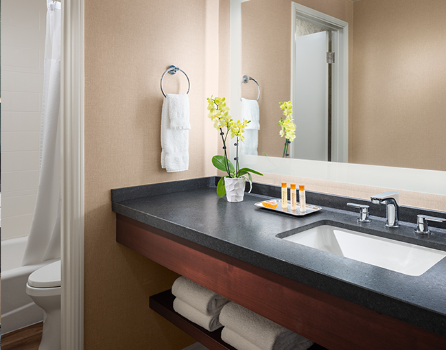 Double sinks with towel rack
