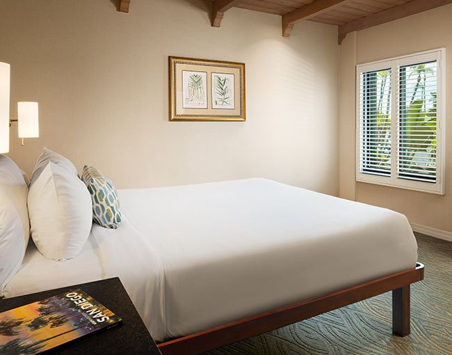 Marina Suite with a queen bed at the Bahia Resort Hotel in Mission Beach, San Diego