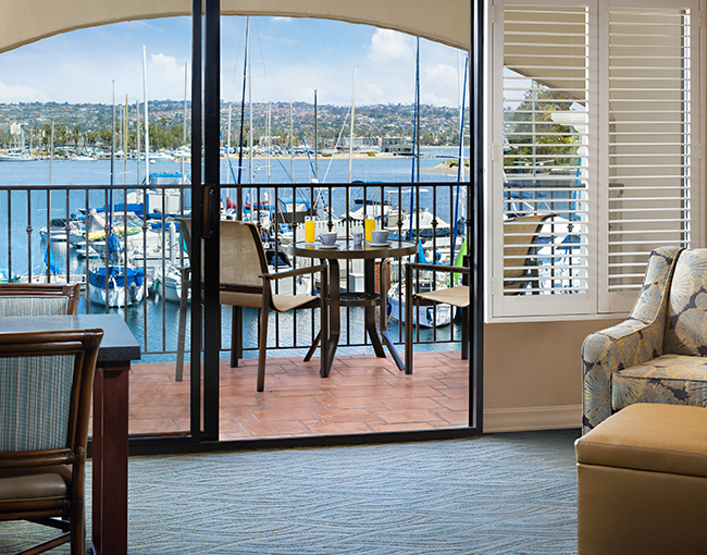 Marina Suite room with a balcony overlooking Mission Bay at the Bahia Resort Hotel in Mission Beach, San Diego