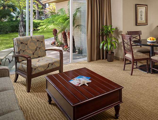 Resort View Suite living room area with a patio at the Bahia Resort Hotel in Mission Beach, San Diego