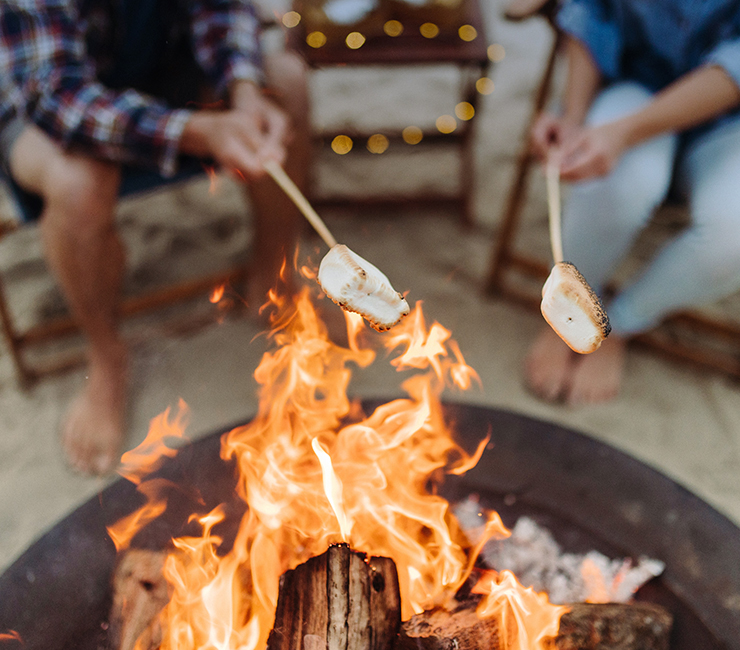 Roasting s'mores on the secluded beach at the Bahia Resort Hotel in Mission Bay, San Diego, CA