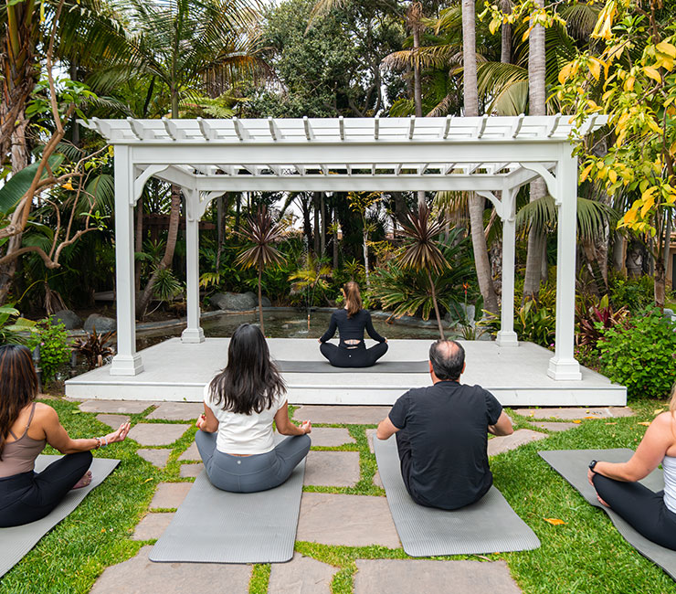 Yoga by the pool at the Bahia Resort Hotel in Mission Bay, San Diego.