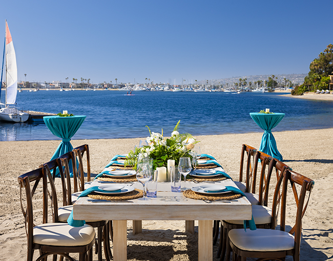 West beach with table and chairs at the Bahia Resort on Mission Bay