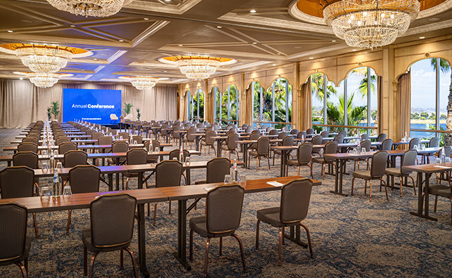 The Mission Bay Ballroom featuring luxurious new carpeting, elegant window treatments, and eight eye-catching chandeliers set up for a classroom style conference at the Bahia Resort Hotel in San Diego.