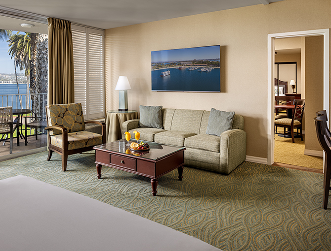 Living area of a Bay Family Suite looking out to Mission Bay at the Bahia Resort Hotel in San Diego