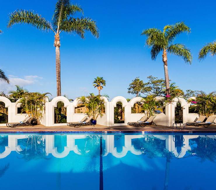 view of the Bahia Resort Hotel junior Olympic size swimming pool at dusk