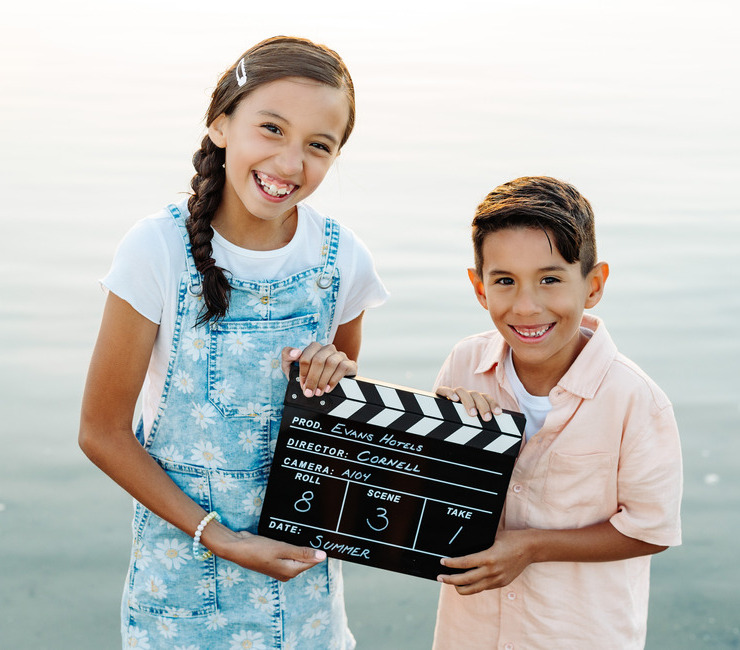 Kids with movie clapperboard