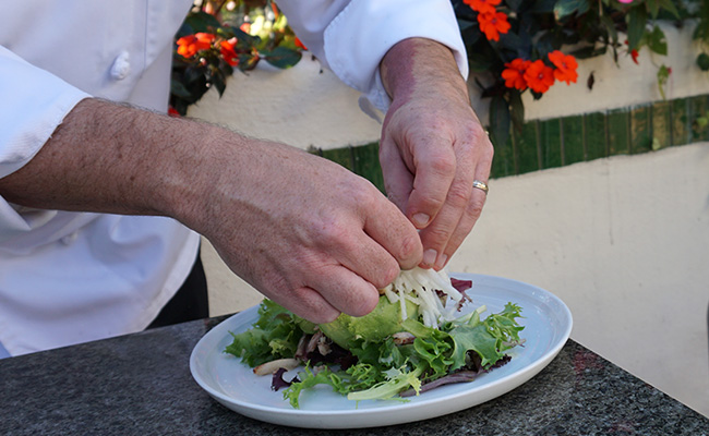 Chef Brett plating the Avocado Salad