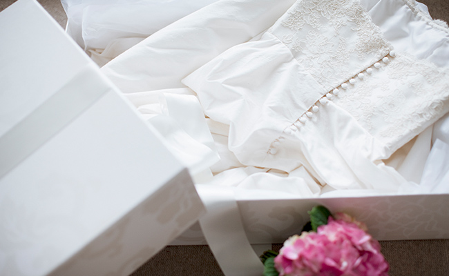 Wedding dress placed inside a box for traveling