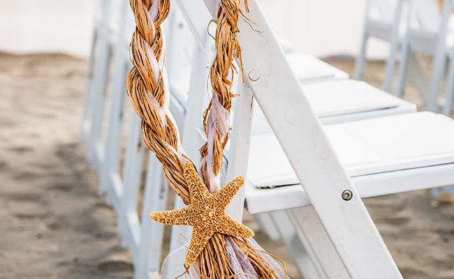 Starfish decor on chair at Beach Wedding