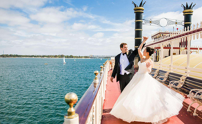 Wedding couple dancing on the upper deck on Mission Bay