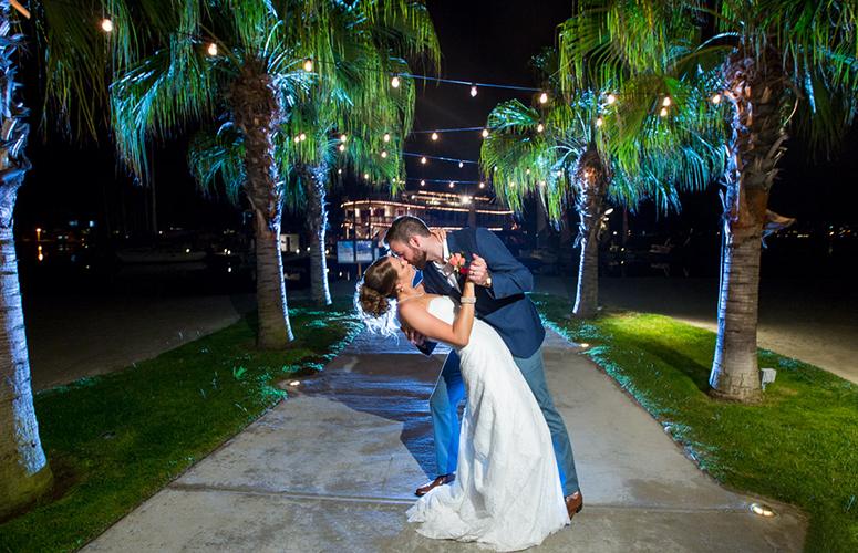 Wedding couple embracing under the stars on Mission Bay